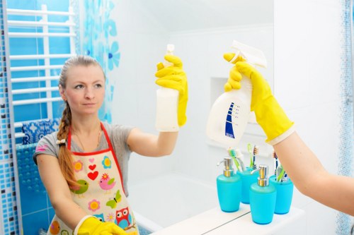 Person deep cleaning an oven with cleaning tools